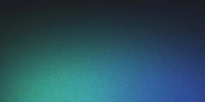 Writer at a desk creating optimized content on a laptop