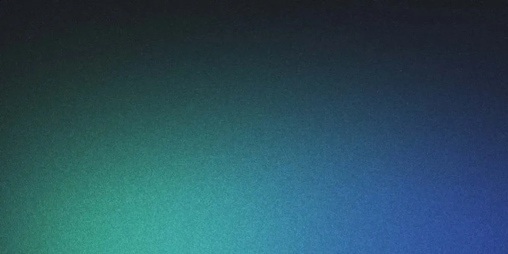 Writer at a desk creating optimized content on a laptop